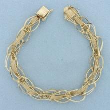 Unique Oval And Wheat Link Charm Bracelet In 14k Yellow Gold