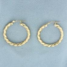 Twisting Hoop Earrings In 14k Yellow Gold