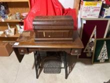 New Home Treadle Sewing Machine with Wrought Iron Base and Accessories