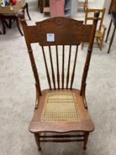 Ornate Spoon Carved Spindle Back Chair with Cane Seat