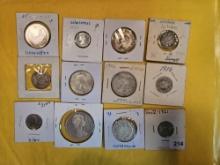 Twelve cooler mixed Silver World coins