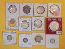 Twelve cooler mixed Silver World coins