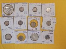 Twelve cooler mixed Silver World coins