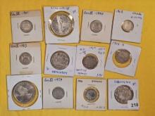 Twelve cooler mixed Silver World coins