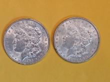 Two Brilliant About Uncirculated plus Morgan Dollars