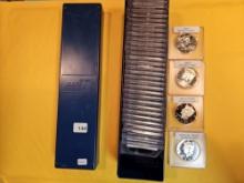 Single-Row Stock box full of Kennedy half Dollars