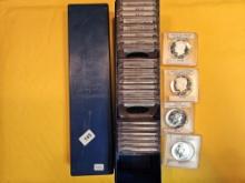 Single-Row Stock box full of Kennedy half Dollars