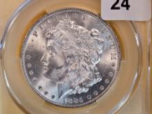 CACG 1885-O Morgan Dollar in Mint State 64