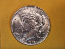 1934-D Peace Dollar in Brilliant About Uncirculated plus