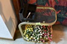 Glass end table with artificial flowers Please bring a bag or box for your items