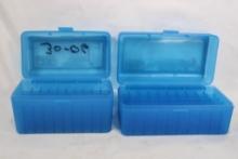 Two clear blue plastic ammo boxes.