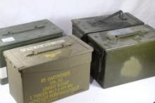 Four green metal 50 cal ammo boxes.