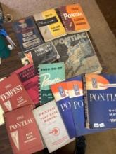 1950's Pontiac parts and car manuals, 13 pieces