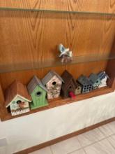 assorted bird houses and porcelain bird figurine