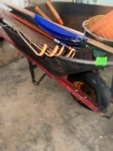 wheelbarrow with misc. yard tools and brush lattice