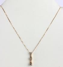 10K YELLOW GOLD THREE DIAMOND NECKLACE 17 INCH