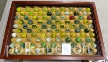 JOHN DEERE MARBLES IN DISPALY CASE