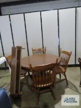 Oak formica top pedestal table with two extra leaves and four chairs