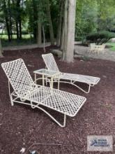 Two Brown Jordan chaise lounge chairs and one glass top end table. model is Tamiami