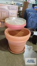 Large clay planters with extra plastic bases