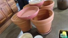 Large clay planters with extra plastic bases