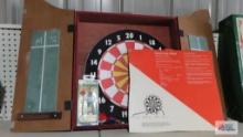 dart board with wooden case and darts