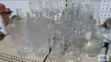 Large amount of glassware including vase, candlesticks, salt and pepper shakers, glasses and