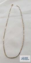 Two tone braided chain, marked 14K