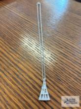 Silver colored triangle shaped clear gemstone pendant, marked 925 on silver colored chain, marked