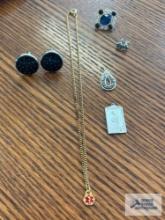 Cufflinks, medical necklace, religious pendants, etc. Description provided by seller.