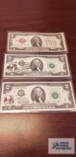 (1) Red label two dollar bill...and (2) black label with stamps two dollar bills