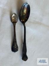 Two spoon pins, smaller one marked Sterling, other one marked Wilbur Silver Company