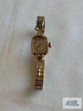 Hamilton gold colored watch, marked 10K gold filled LSK on gold colored band, marked Speidel