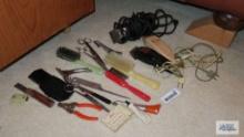 Assorted barber tools and brushes and scissors