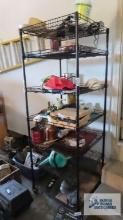 Black adjustable wire shelving unit in garage