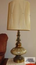 Pair of very ornate lamps with embellishments and metal base