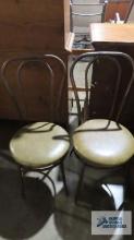 Two ice cream style chairs with metal frames