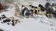 Cow figurines and piggy bank