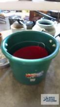 Large plastic bucket and smaller metal bucket