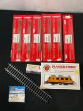 Assorted Fleischmann Track Pieces, Bachmann Union Pacific Train Car, one track piece, and connect...