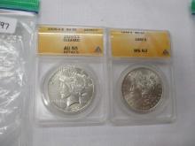 ANACS slabs Morgan dollar 1898 MS62, Peace dollar 1926S AU55 cleaned, 2 coins