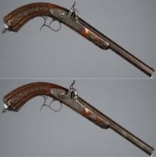 Ornately Engraved and Carved Pair of F.P. Caron Dueling Pistols