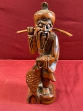 Vintage 10.5" hand carved wood fisherman sculpture