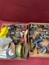 15) assorted fishing reels, hooks, fishing items.