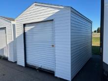 1956 10’x12’ Storage Shed with 6’ Rollup Door, White in Color