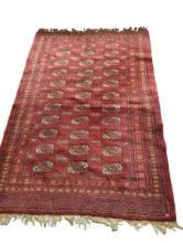 Red Rug with Geometric Pattern and Fringe