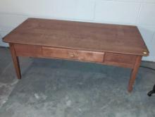 (BASE) WOODEN COFFEE TABLE WITH SINGLE DRAWER AND TAPERED LEGS. MEASURES 42"W X 20"D X 16"T. DOES