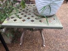 (BY) METAL OUTDOOR SIDE TABLE WITH LATTICE TOP AND DECORATIVE BASE. IT MEASURES 20"SQ X 18-1/2"T.