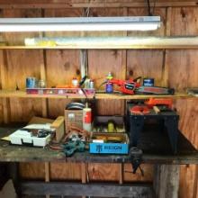 Group of Tools and More on Workbench in Shed