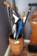 ANTIQUE NAIL KEG WITH CANES AND UMBRELLAS